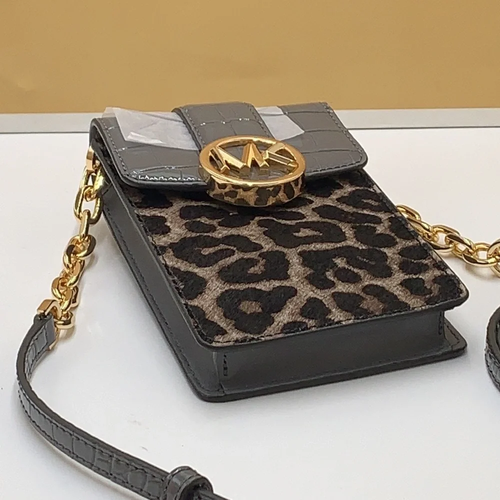 Brand New with Tag
Michael Kors Carmen Small NS Phone XBODY HairCalf Gre… - Picture 8 of 16